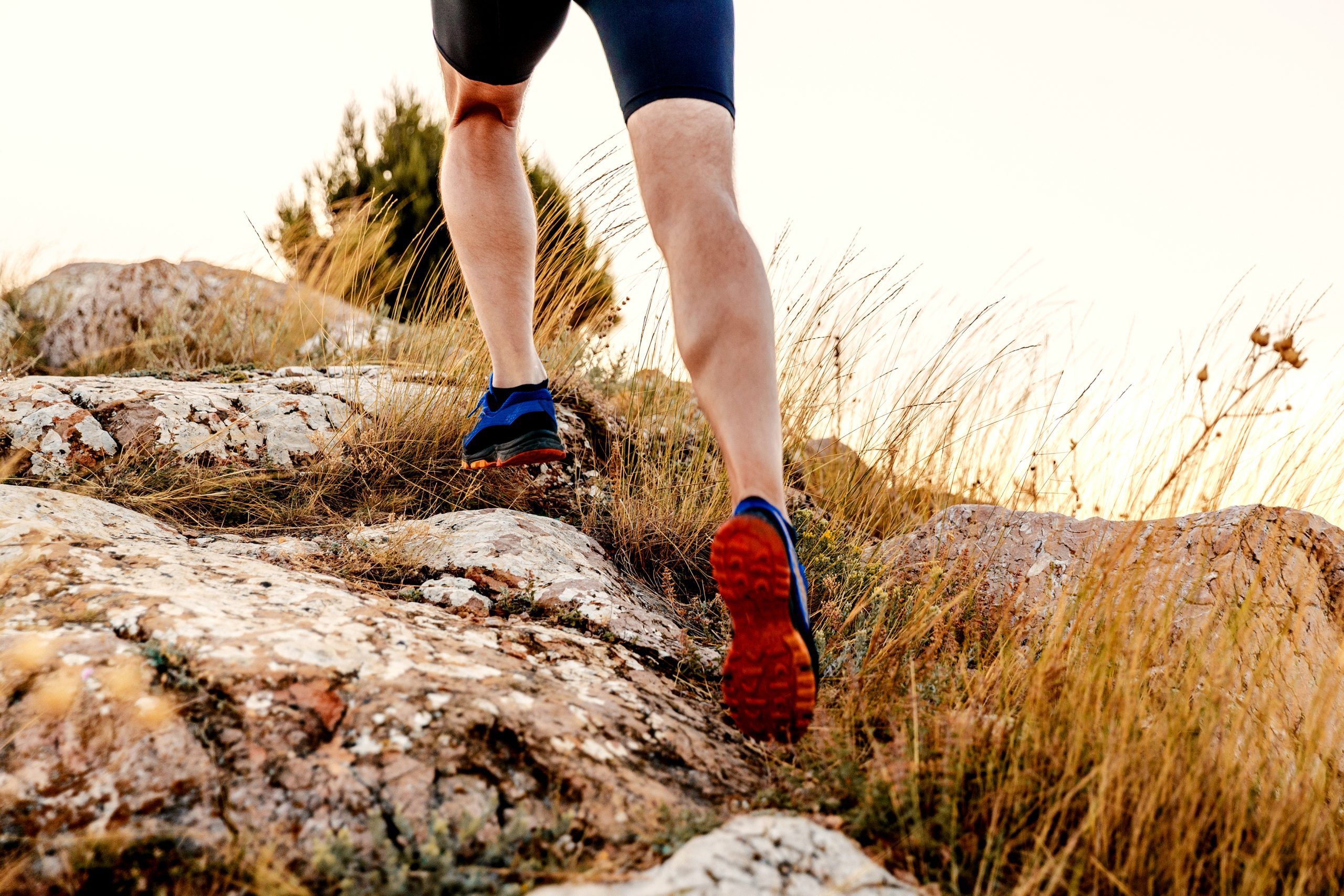 legs men runner athlete running uphill in mountain